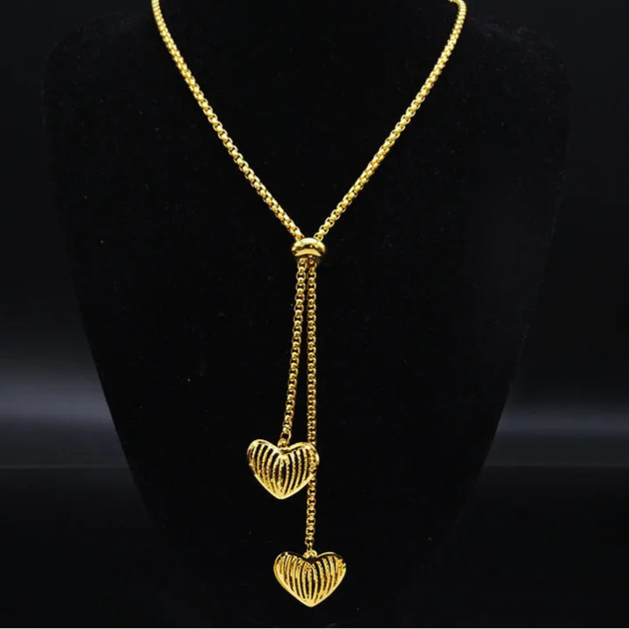 Long gold stainless steel necklace with heart detail.