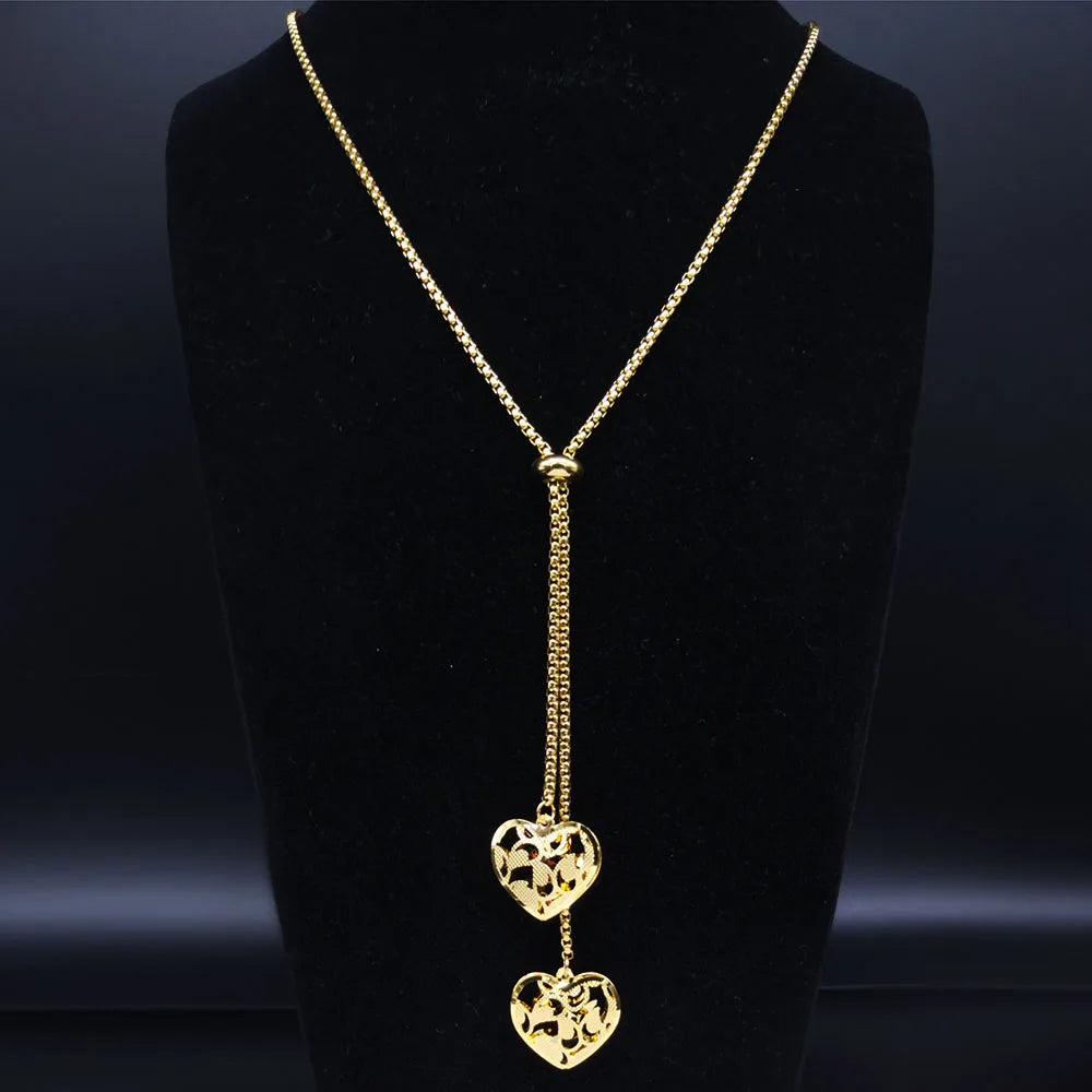 Long gold stainless steel necklace with heart detail.