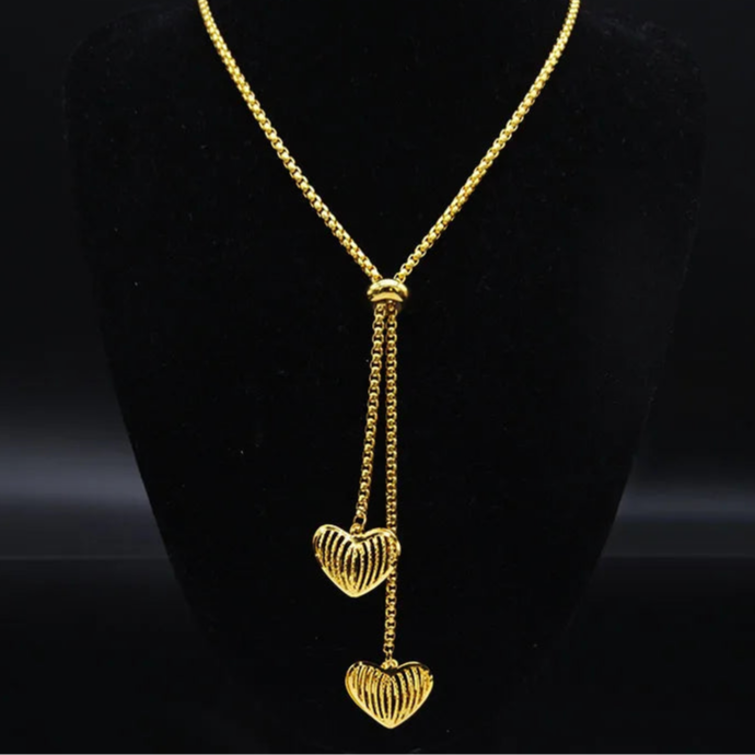 Long gold stainless steel necklace with heart detail.