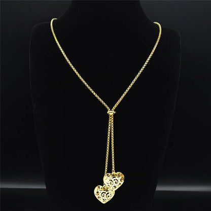 Long gold stainless steel necklace with heart detail.