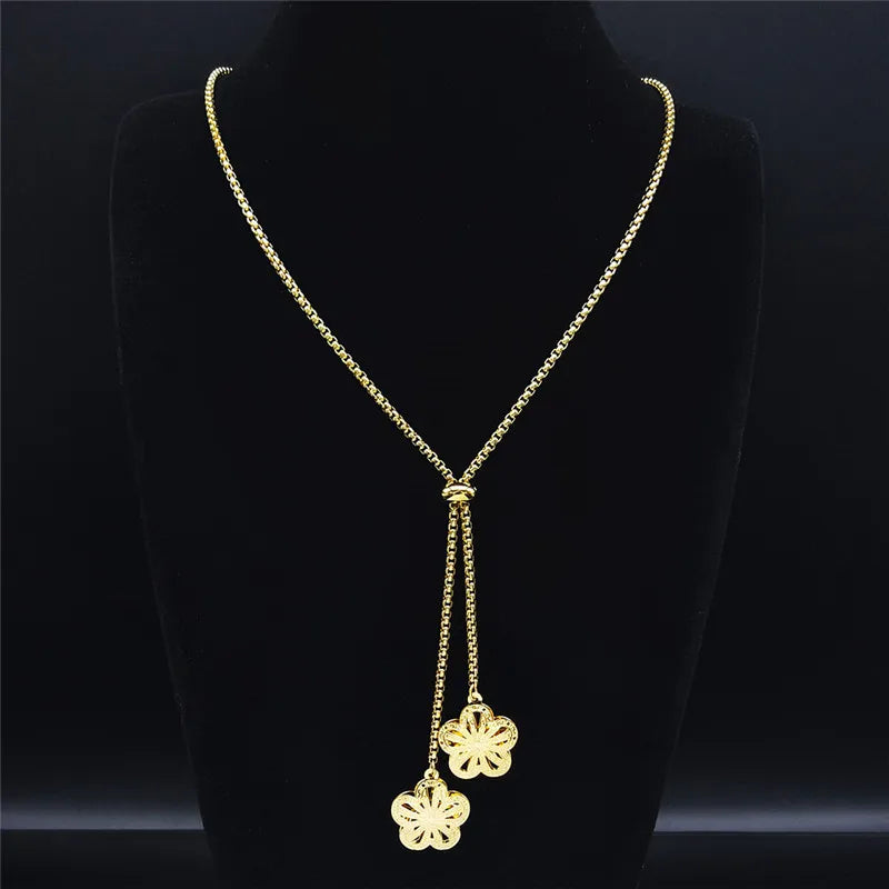 Long gold stainless steel necklace with heart detail.