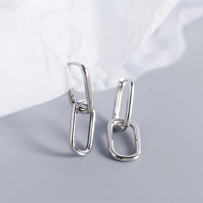 Silver earrings with long buckle.