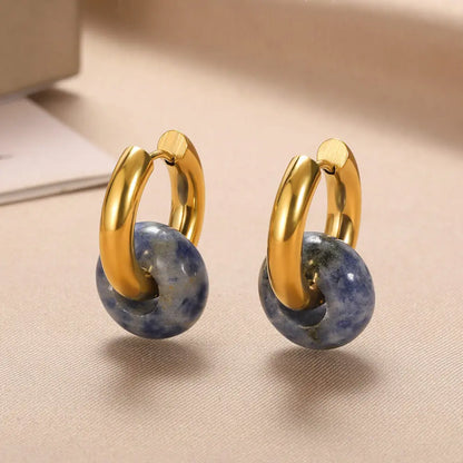 Natural stone dangle earrings. Round gold-colored opal and stainless steel earrings.