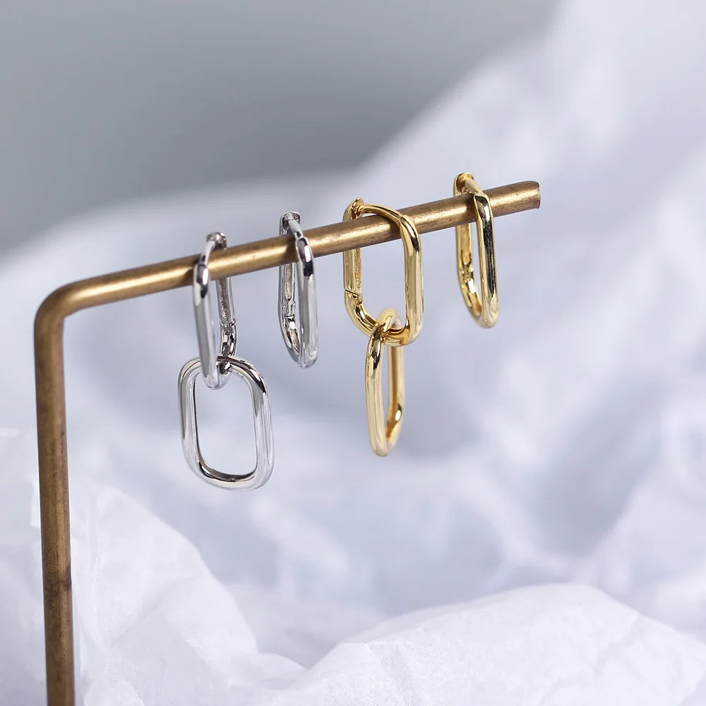 Silver earrings with long buckle.