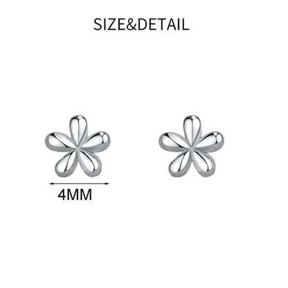 Flower-shaped stud earrings. Gold and silver